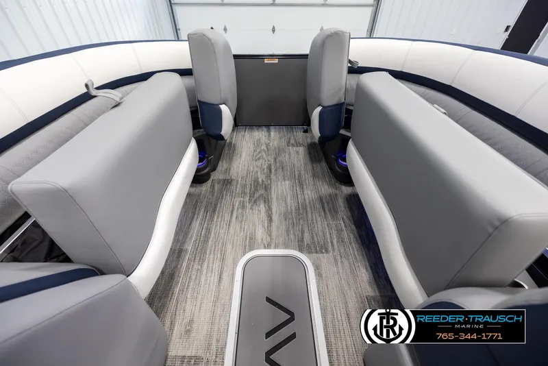 Slide: The Image of 2025 Avalon Catalina Entertainer interior with modern seating and flooring, Reeder-Trausch Marine logo. - 19