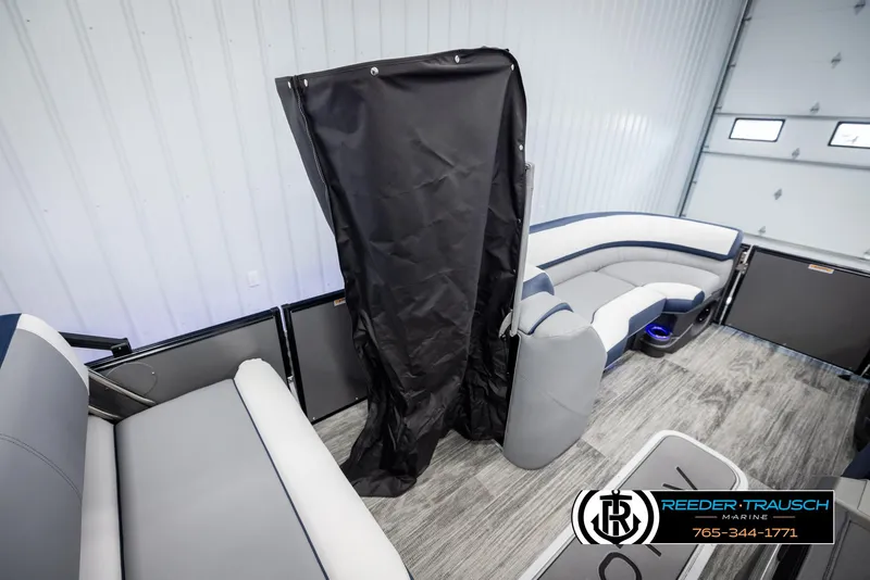 Slide: The Image of 2025 Avalon Catalina Entertainer interior with modern seating and flooring, Reeder-Trausch Marine branding. - 21