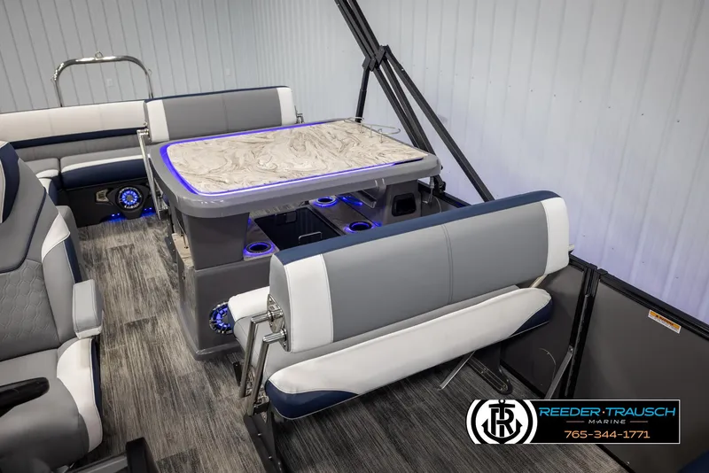 Slide: The Image of Luxurious interior of 2025 Avalon Catalina Entertainer pontoon boat with stylish seating and table. - 24