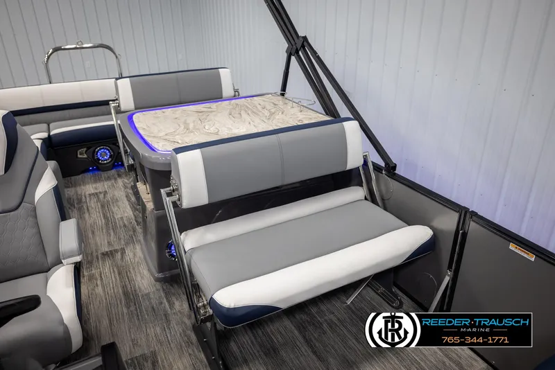 Slide: The Image of 2025 Avalon Catalina Entertainer boat interior with modern seating and table design. - 25