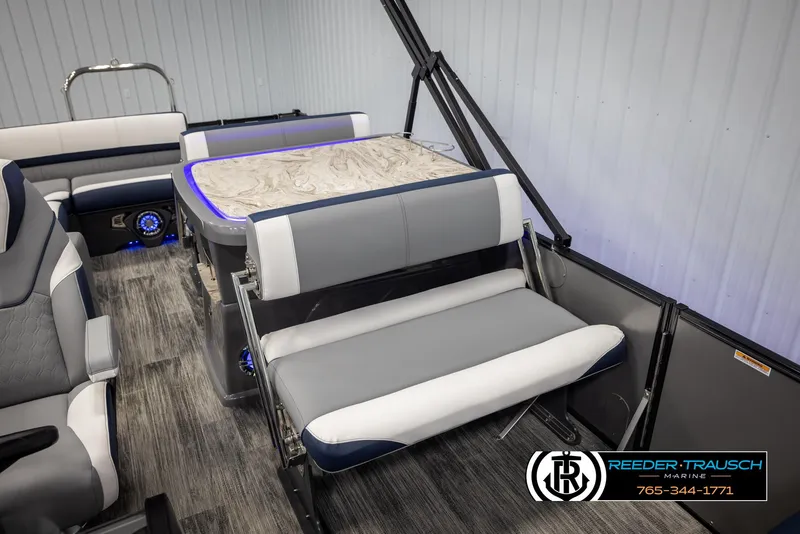 Slide: The Image of 2025 Avalon Catalina Entertainer boat interior with modern seating and table design. - 26