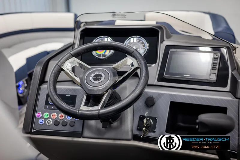 Slide: The Image of 2025 Avalon Catalina Entertainer dashboard with steering wheel and digital display. - 27