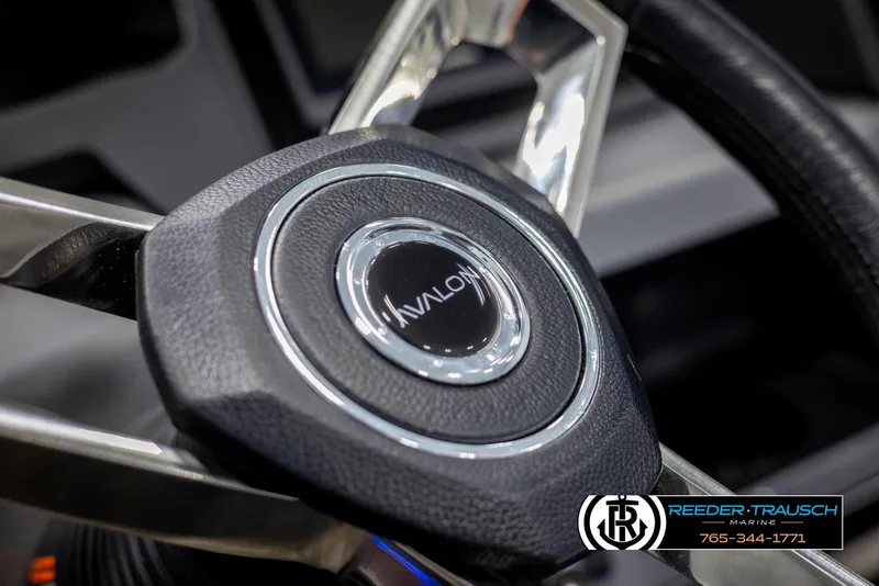 Slide: The Image of Steering wheel of 2025 Avalon Catalina Entertainer boat, featuring sleek design and logo. - 29
