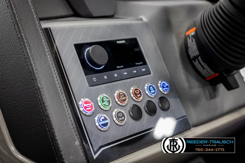 Slide: The Image of Control panel of 2025 Avalon Catalina Entertainer boat with various buttons and display. - 30