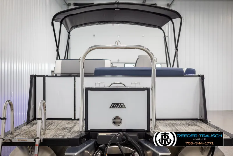 Slide: The Image of 2025 Avalon Catalina Entertainer boat in showroom, rear view with canopy and seating. - 7