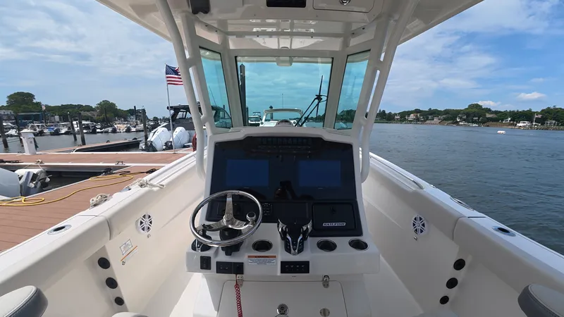 Slide: The Image of Interior view of 2025 Sailfish 272 CC boat at dock. - 14