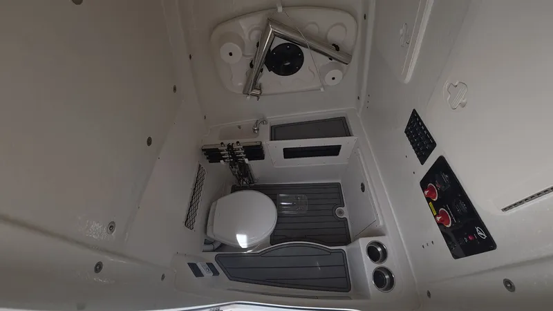 Slide: The Image of Interior of 2025 Sailfish 272 CC with toilet and controls. - 20