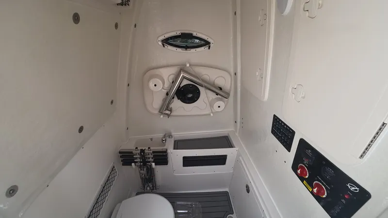 Slide: The Image of Interior of 2025 Sailfish 272 CC with controls and storage. - 21
