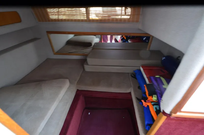 Slide: The Image of Interior cabin of 1992 Sea Ray 290 Sundancer with seating and storage. - 10