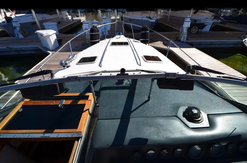 Slide: The Image of 1992 Sea Ray 290 Sundancer boat docked at marina, view from cockpit. - 14