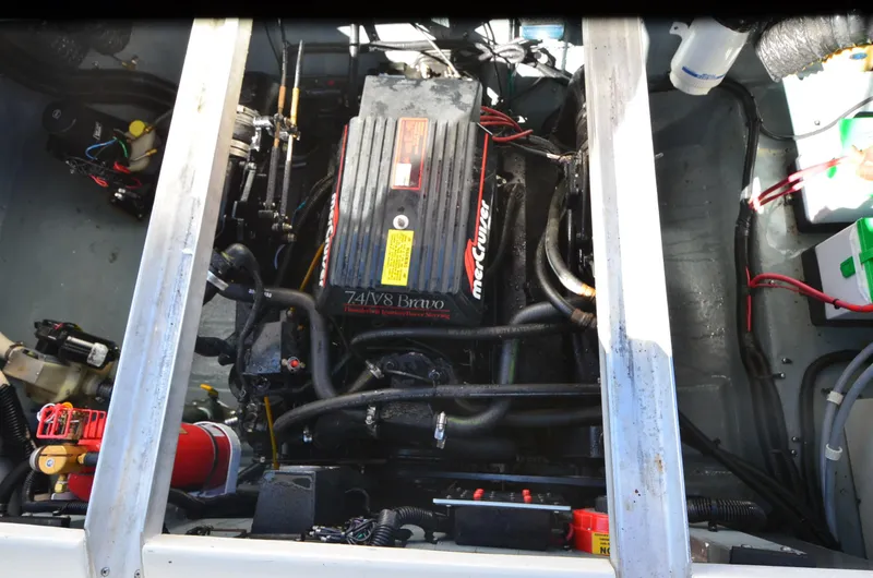 Slide: The Image of Engine compartment of a 1992 Sea Ray 290 Sundancer boat, featuring a MerCruiser engine. - 22
