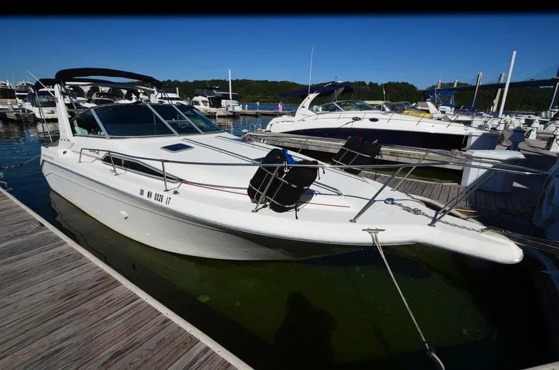 Slide: The Image of 1992 Sea Ray 290 Sundancer docked at marina, sunny day, calm waters. - 28