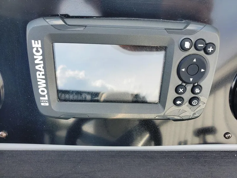 Slide: The Image of Lowrance marine GPS device on 2021 Godfrey Monaco 235RL boat dashboard. - 13