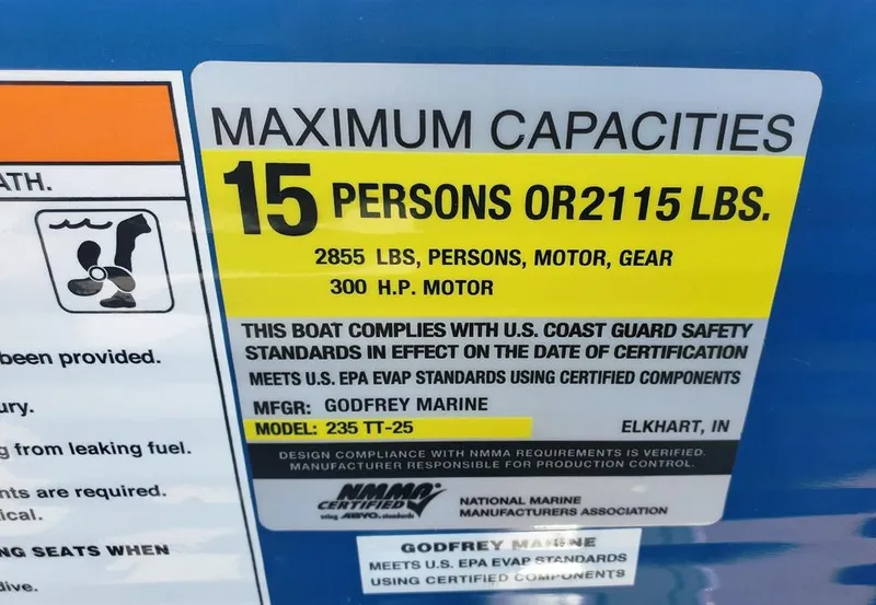 Slide: The Image of Maximum capacity label for 2021 Godfrey Monaco 235RL boat, 15 persons or 2115 lbs. - 16