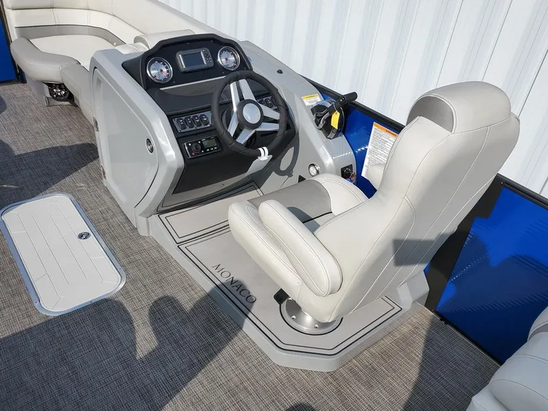 Slide: The Image of 2021 Godfrey Monaco 235RL boat helm with steering wheel and captain's chair. - 3