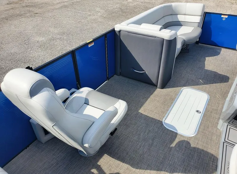 Slide: The Image of 2021 Godfrey Monaco 235RL triple tube pontoon boat interior with plush seating and carpeted floor. - 4