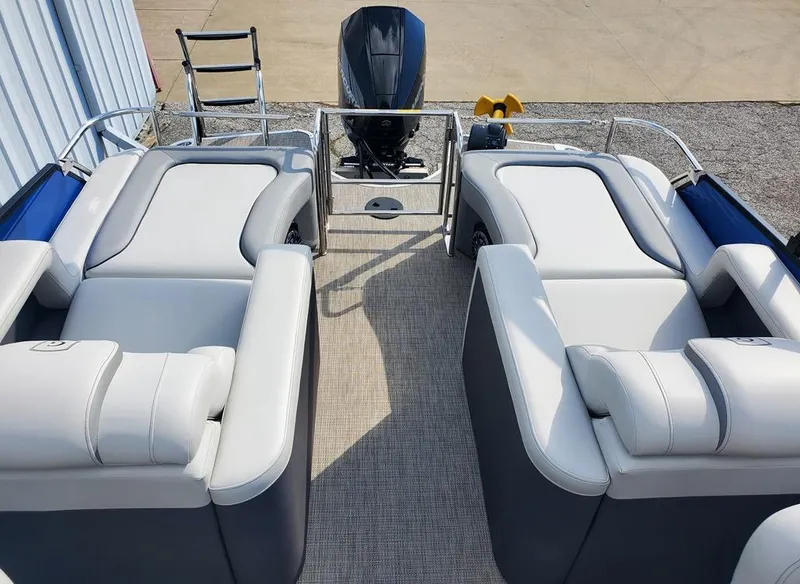 Slide: The Image of 2021 Godfrey Monaco 235RL triple tube pontoon boat with plush seating and outboard motor. - 5