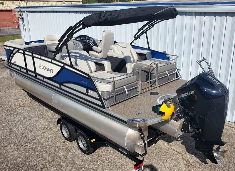 Slide: The Image of 2021 Godfrey Monaco 235RL triple tube pontoon boat with Mercury engine on trailer. - 7