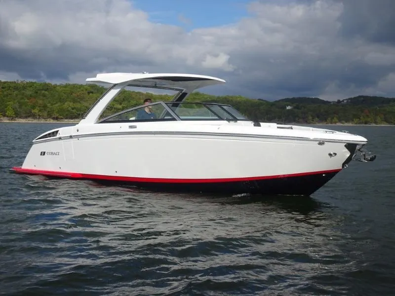 The Image of 2025 Cobalt R33 boat on a lake with scenic background. - 0
