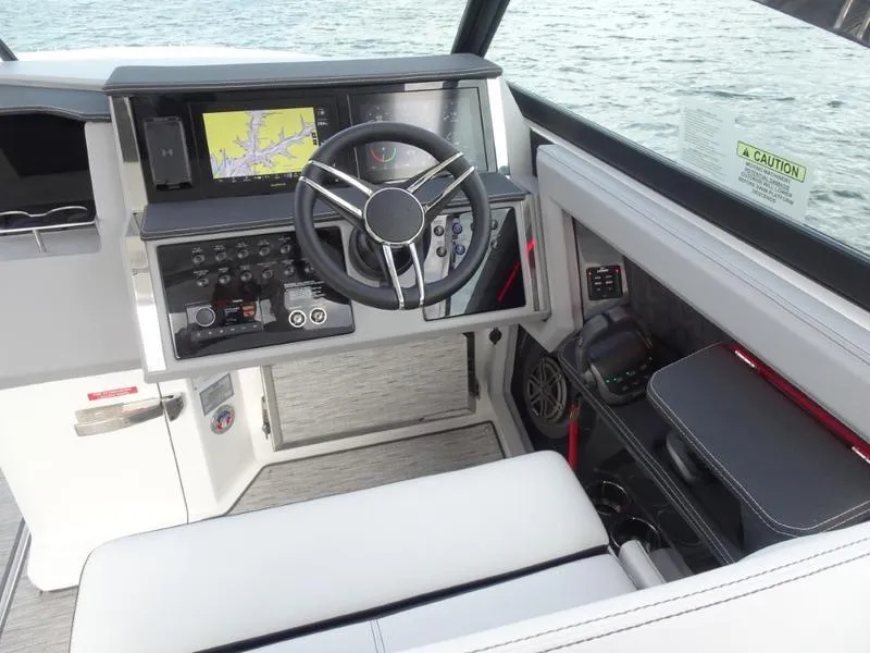 Slide: The Image of Modern Cobalt R33 boat cockpit with advanced navigation system, steering wheel, and control panel, 2025 model. - 22