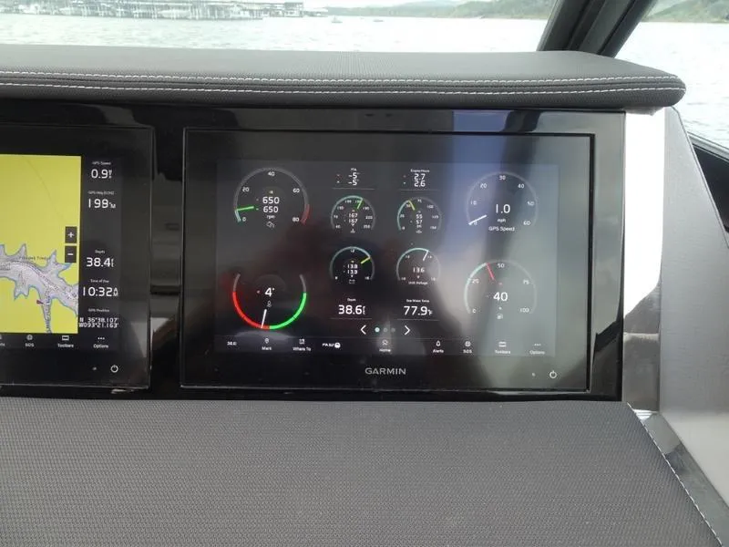 Slide: The Image of Dashboard of 2025 Cobalt R33 with digital gauges and navigation display. - 23