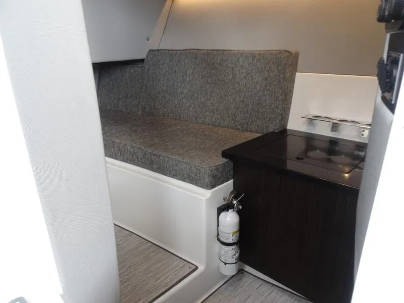 Slide: The Image of Interior of 2025 Cobalt R33 boat with seating and kitchenette area. - 30