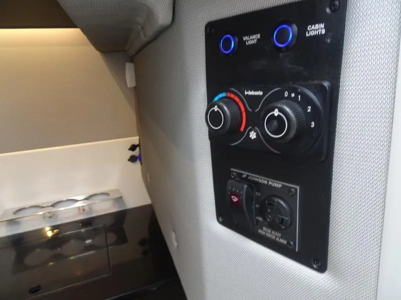 Slide: The Image of Control panel in 2025 Cobalt R33 cabin with lighting and temperature dials. - 31