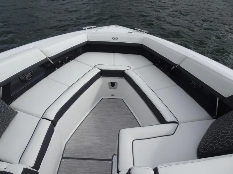 Slide: The Image of Luxurious seating area on 2025 Cobalt R33 boat, featuring sleek white and black upholstery. - 32