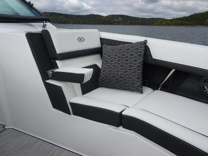 Slide: The Image of Luxurious seating on 2025 Cobalt R33 boat with stylish cushion, lake view. - 34