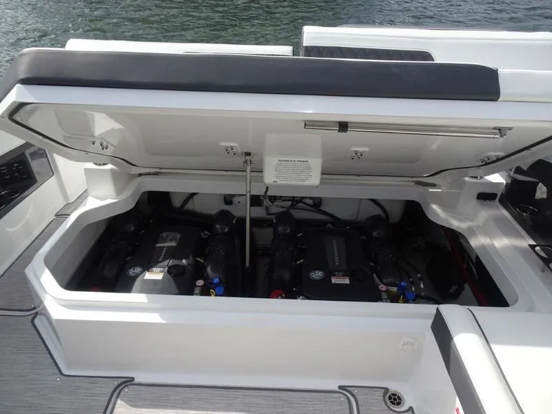 Slide: The Image of Open engine compartment of 2025 Cobalt R33 boat, showing dual engines. - 36