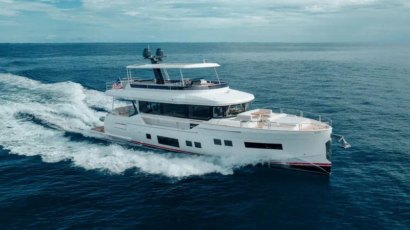 Slide: The Image of 2023 Sirena 68 yacht cruising on open ocean waters. - 11