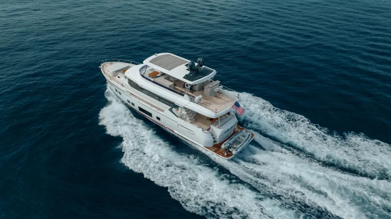 Slide: The Image of 2023 Sirena 68 yacht cruising on open sea, aerial view. - 14