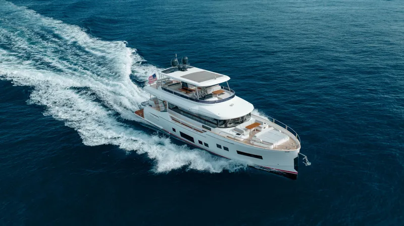 Slide: The Image of 2023 Sirena 68 yacht cruising on open sea. - 16