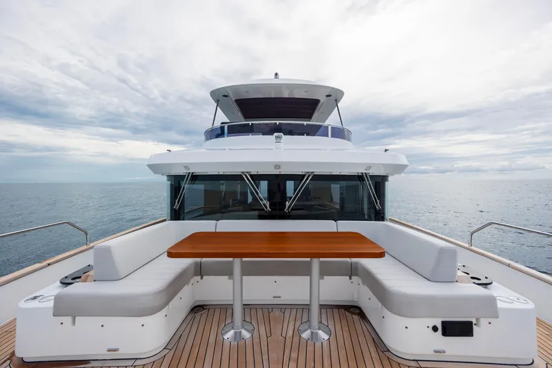 Slide: The Image of Luxurious 2023 Sirena 68 yacht with spacious deck seating and ocean view. - 20