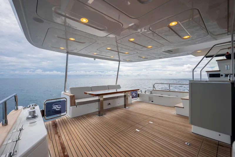 Slide: The Image of Spacious deck of 2023 Sirena 68 yacht with ocean view and modern seating. - 21