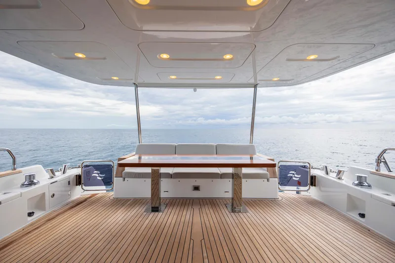 Slide: The Image of Luxurious 2023 Sirena 68 yacht deck with ocean view and elegant seating area. - 22