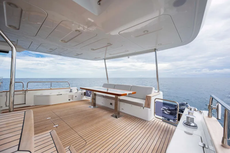 Slide: The Image of Spacious deck of 2023 Sirena 68 yacht with ocean view and seating area. - 23