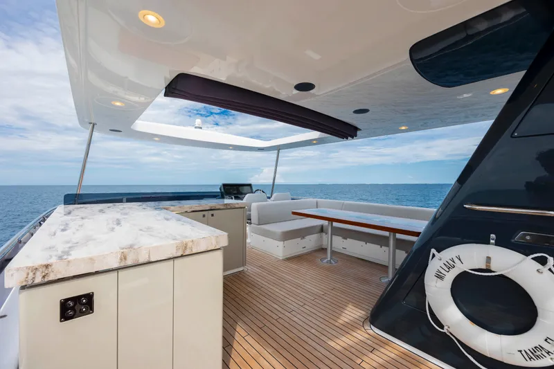 Slide: The Image of Luxurious 2023 Sirena 68 yacht deck with seating, ocean view, and modern design. - 24