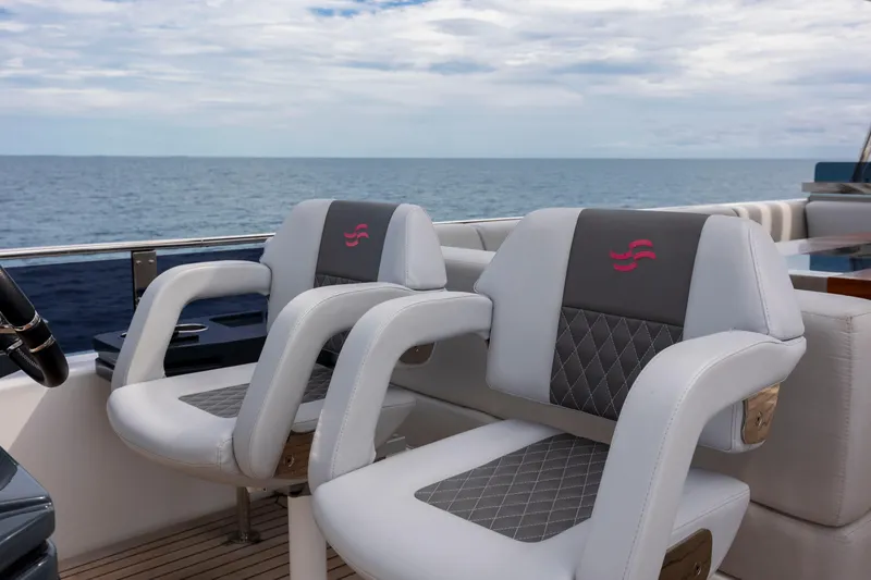 Slide: The Image of Luxury seating on 2023 Sirena 68 yacht, overlooking the ocean. - 26