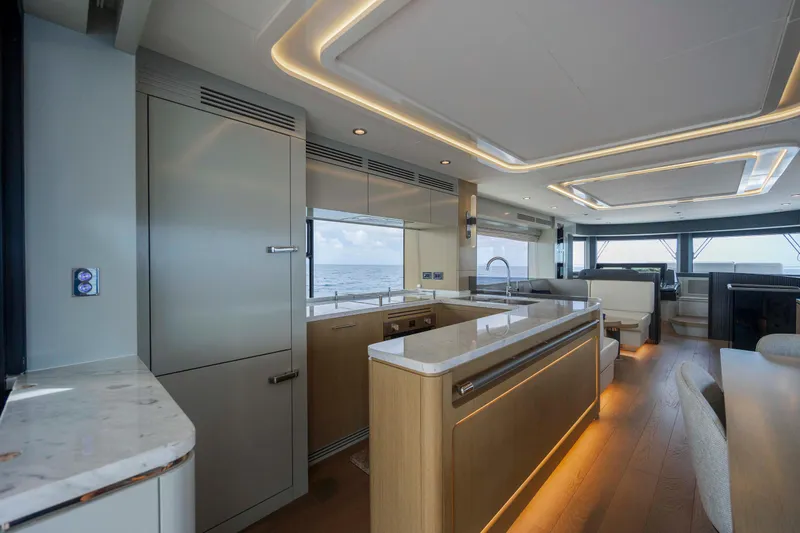 Slide: The Image of Luxurious interior of 2023 Sirena 68 yacht with modern kitchen and ocean view. - 29