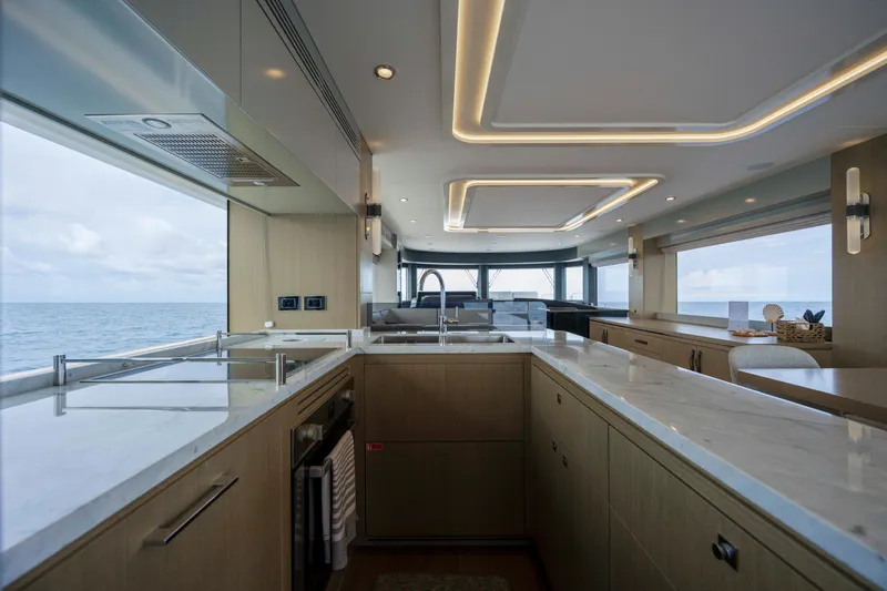 Slide: The Image of Luxurious interior of 2023 Sirena 68 yacht with modern kitchen and ocean view. - 31