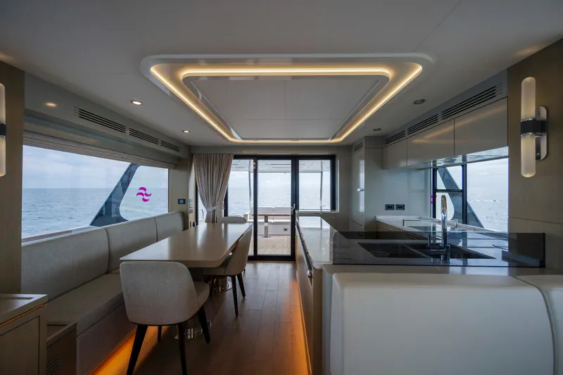 Slide: The Image of Luxurious interior of 2023 Sirena 68 yacht with modern kitchen and dining area. - 32