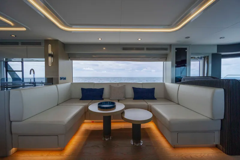 Slide: The Image of Luxurious interior of 2023 Sirena 68 yacht with elegant seating and ocean view. - 38