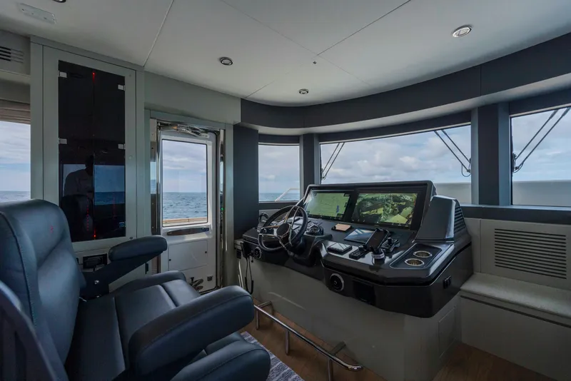 Slide: The Image of Modern helm of 2023 Sirena 68 yacht with ocean view. - 42