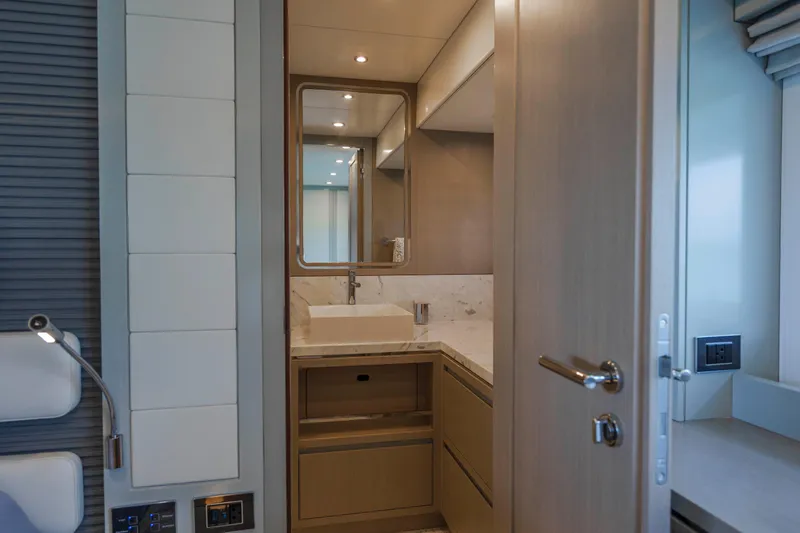 Slide: The Image of Luxurious bathroom interior of 2023 Sirena 68 yacht with modern fixtures and wood accents. - 48