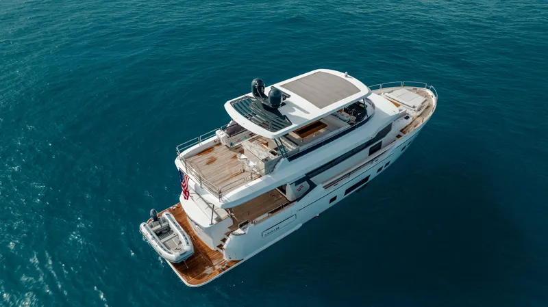 Slide: The Image of Luxury Sirena 68 yacht cruising on open sea, 2023 model. - 8