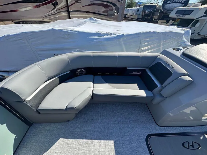 Slide: The Image of 2024 Harris Solstice 230 boat interior with gray seating and modern design. - 10