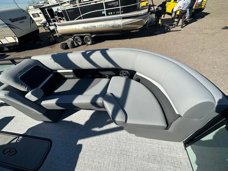 Slide: The Image of 2024 Harris Solstice 230 boat with sleek gray seating and modern design. - 4