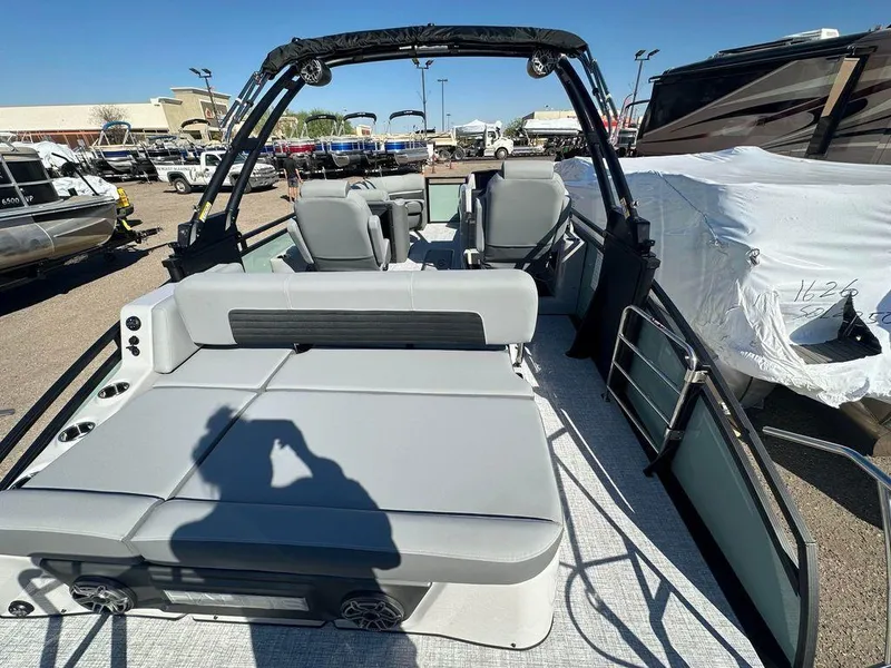 Slide: The Image of 2024 Harris Solstice 230 pontoon boat with spacious seating and modern design. - 6