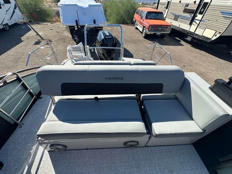 Slide: The Image of 2024 Harris Solstice 230 pontoon boat with gray seating and sleek design. - 8